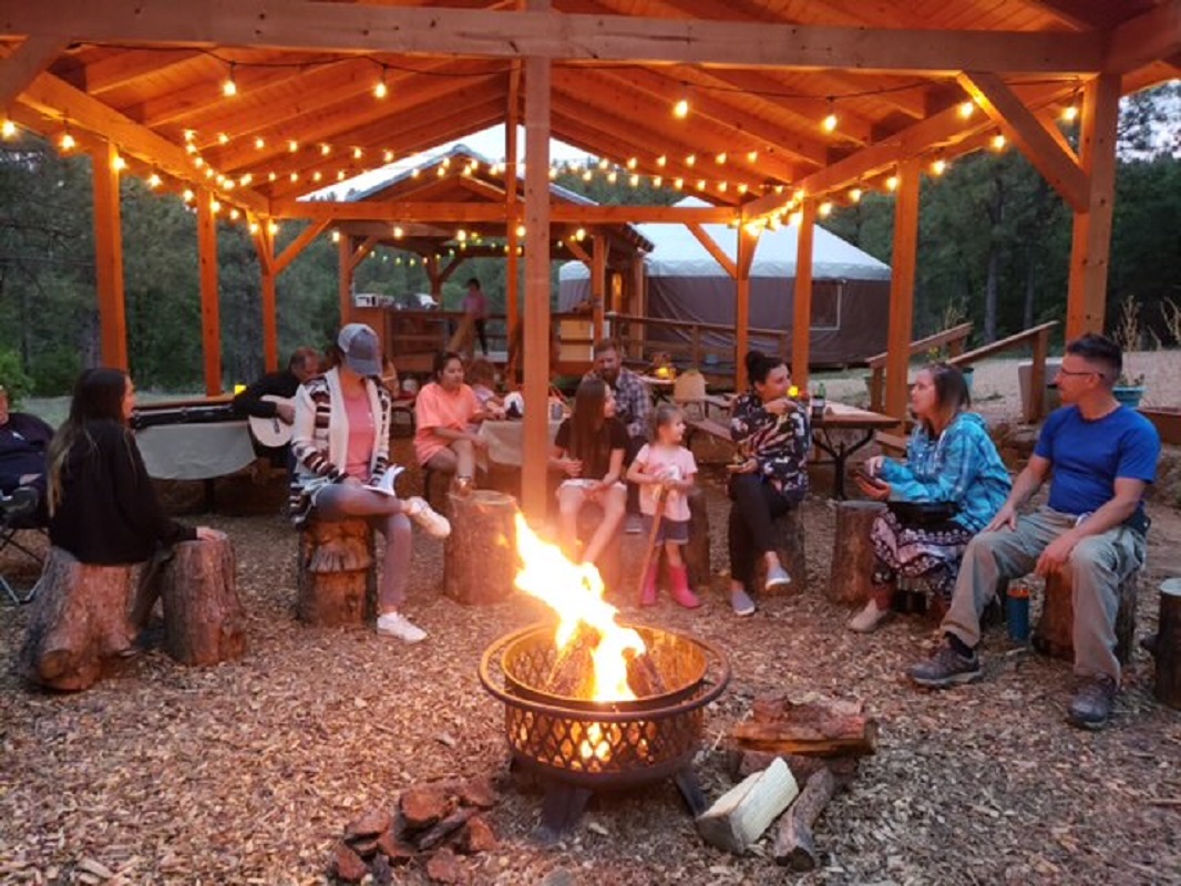 This image shows a gathering around a campfire.