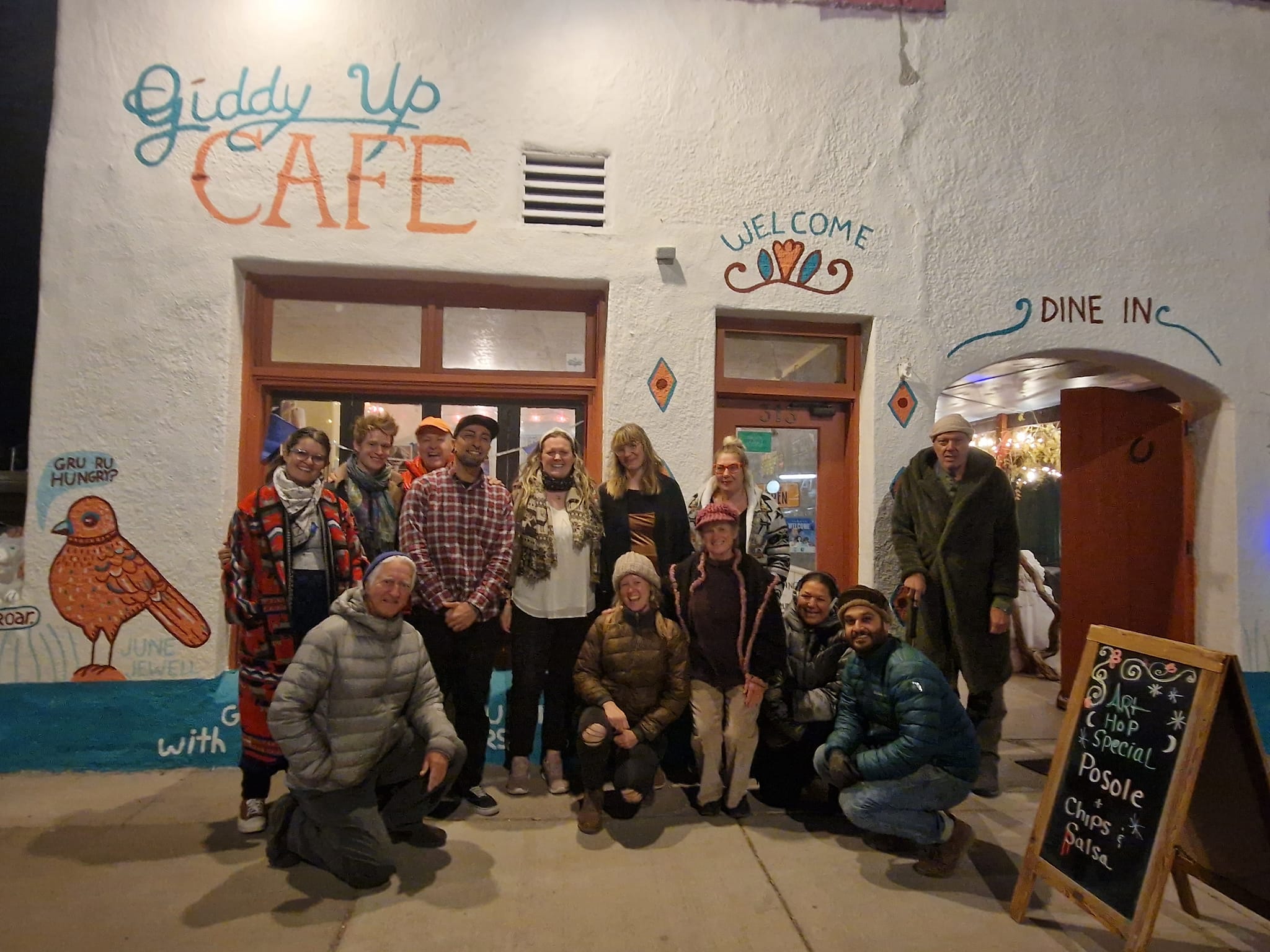A group of people gathers outside a cafe in Truth or Consequences, NM